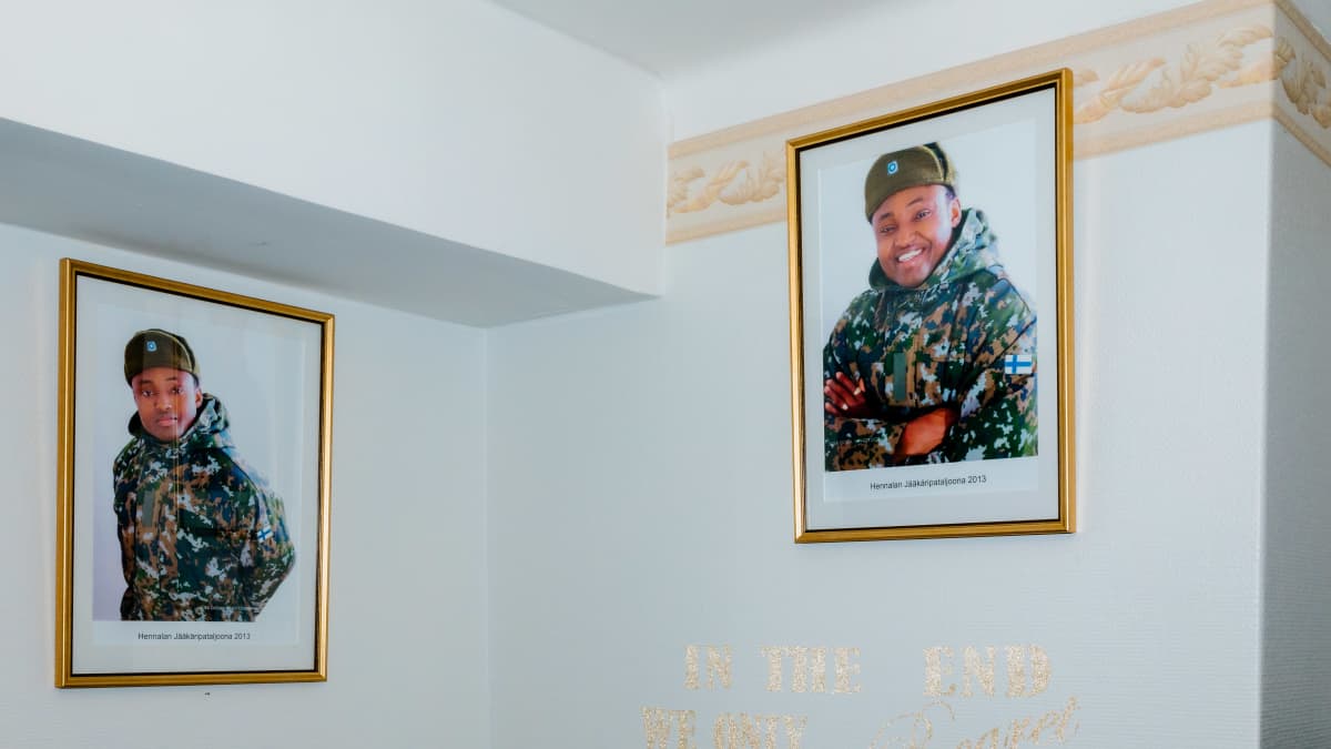 Simon Ekpa's army pictures on the wall.