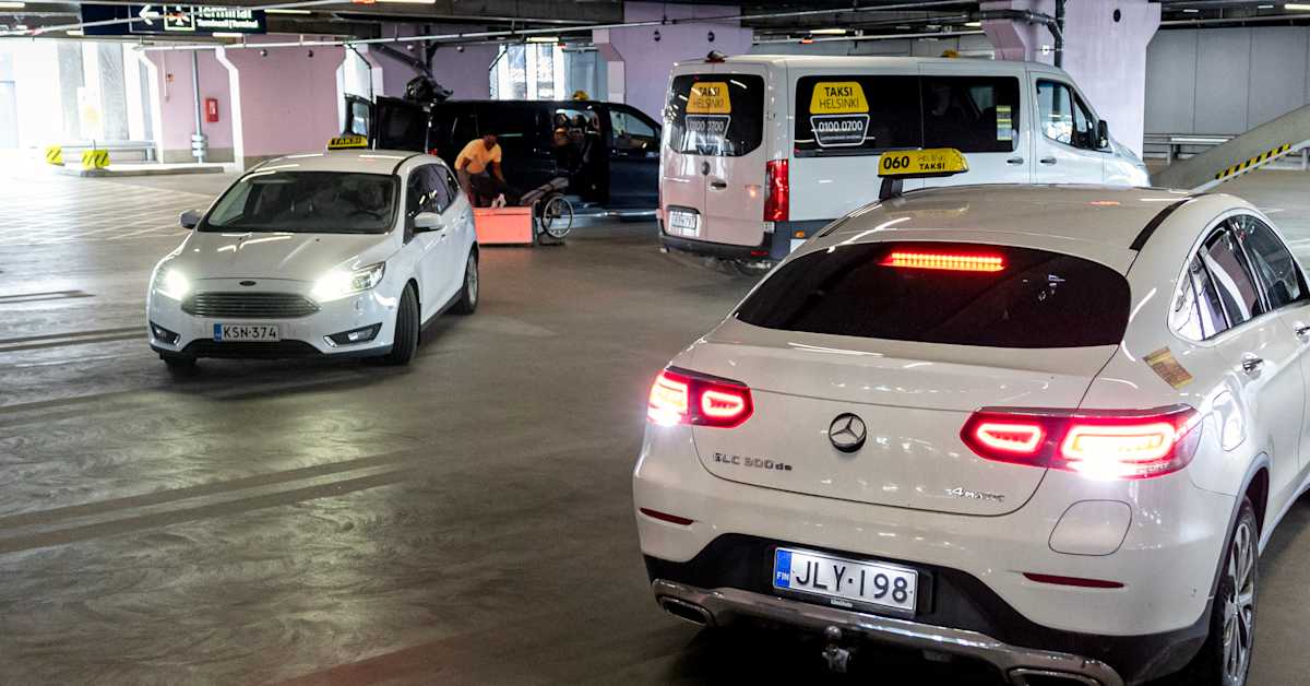Helsinki Airport's app-based taxi meeting point bustles with activity