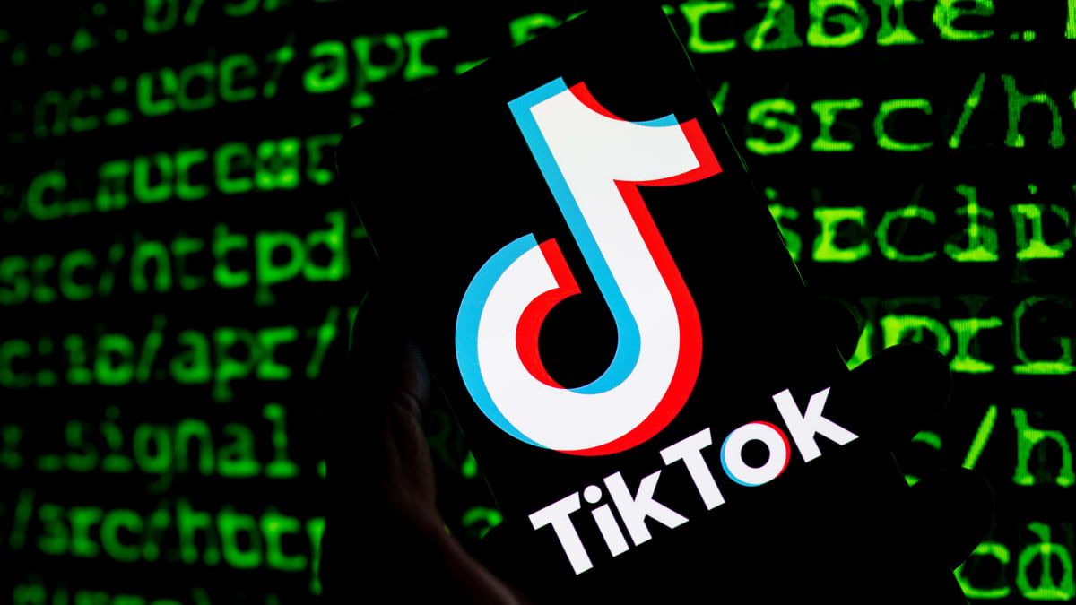 Tiktok logo over black screen with green text.