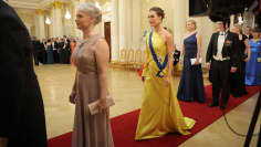 Former Prime Minister Sanna Marin in a yellow dress at the Presidential Reception.