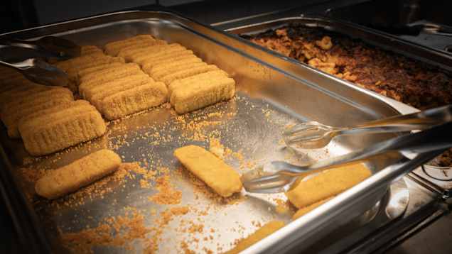 Fish fingers in an oven tray.