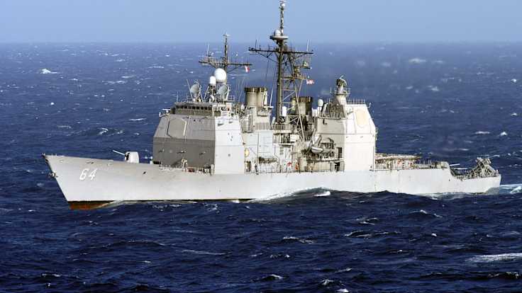 A light grey warship at sea.