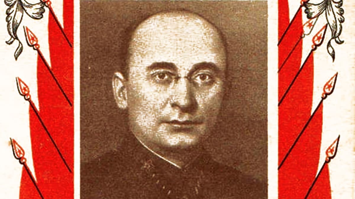 Berija vanhassa Neuvosto-julisteessa, punavalkoinen reunus. Berijalla on silmälasit ja kalju pää. 