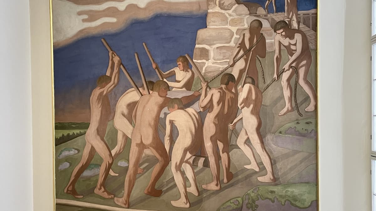 Kuvassa fresko, jossa alastomat miehet siirtävät suurta kiveä.