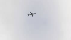 Photo shows an aircraft flying in the sky.