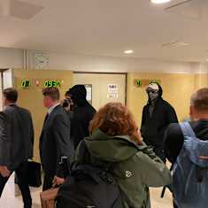 Three of the suspects arriving into court on Tuesday morning. One of them choose not to hide his face.