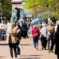 Photo shows people walking along the Esplanade in Helsinki.