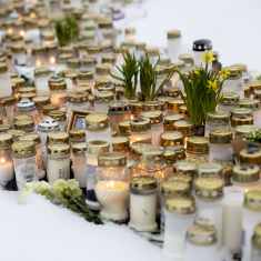 Candles outside Viertola school after a shooting there on 2 April 2024. 