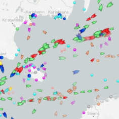 Screengrab of the Marinetraffic website showing ship traffic in the Baltic Sea, marked with small ship icons in various colours.
