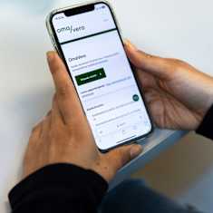 A person browsing Finland's online tax service on their smart phone.