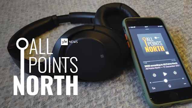 Image shows a set of headphones beside a phone 