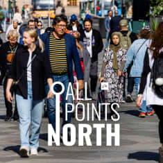 Photo shows people walking on the street in Helsinki with the All Points North logo in the centre.