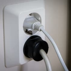 Power cords plugged in at the socket.