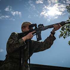 A reservist firing a Nato-compatible assault rifle at a Finnish Defence Forces demonstration in June 2023.