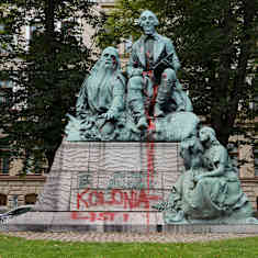 The Elias Lönnrot monument in Helsinki covered in a red substance.