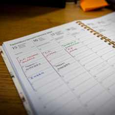 Photo shows a diary on a table.