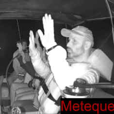 En skärmdump från en video från Gazakonvojen Global Sumud Flotilla, som visar människor ombord på en av båtarna med händerna uppe. 