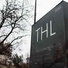 Photo shows THL's logo on a sign outside its main office building in Helsinki.