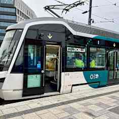 Photo shows a tram crashed into a traffic barrier.