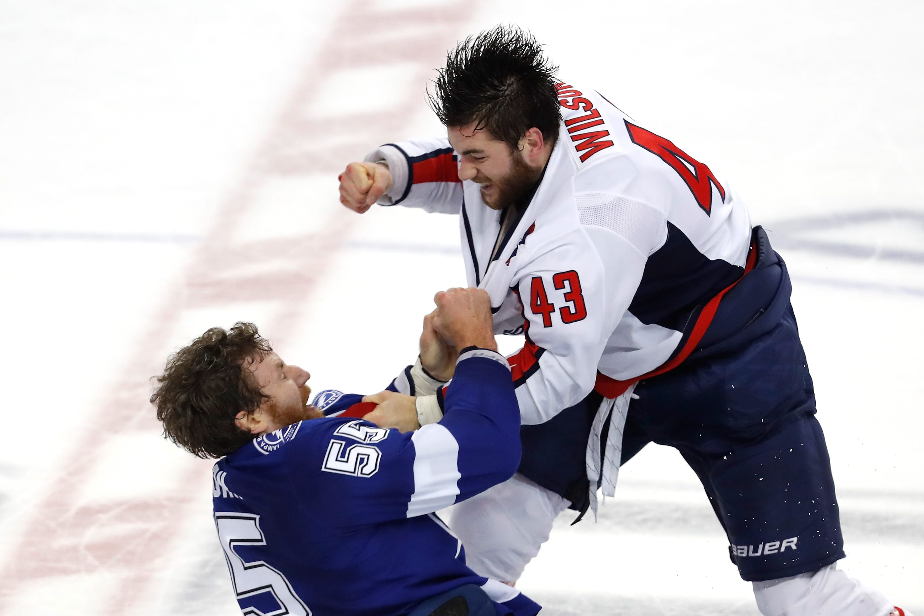 Braydon Coburn #55 of the Tampa Bay Lightning fights with Tom Wilson #43 of the Washington Capitals during the first period in Game Seven of the Eastern Conference Finals during the 2018 NHL Stanley Cup Playoffs at Amalie Arena on May 23, 2018 in Tampa, Florida