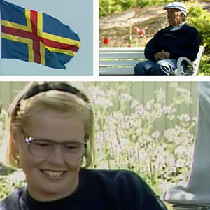 Ahvenanmaalaisia ja itsehallinnon symboleita: lippu ja postimerkki vuodelta 1990