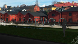Planerna på bokstäver vid åstranden i Borgå får kritik. En bild av hur bokstäverna kan se ut. Porvoo bokstäver stående i grått med strandbodarna i bakgrunden.