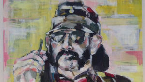 Lasse Grönroos vägg pryds av en Lemmy-tavla. Konstnären bakom 40-årsgåvan heter Tanja Is. Lasse Grönroos tavla av Lemmy Kilmister. Signerad T. Lönnroth. Konstnär Tanja Is.