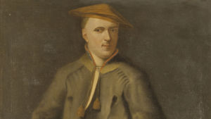 En detalj ur Martin Hoffmans målning 1737 av Carl Linnæus eller Carolus Linnæus, som Linné hette före kungen adlade honom 1757. Linnæus är klädd i lappdräkt. Yksityiskohta Martin Hoffmanin maalauksesta vuodelta 1737 Carl von Linnéstä kädessään hänen mukaansa nimetty kasvi Linnaea borealis (vanamo). Taustalla piirros Linnén kirjasta Praeludia Sponsaliorum Plantarum (1729).