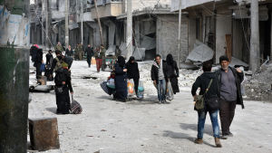 Den statliga syriska nyhetsbyråns (SANA) foto på människor som lämnade ett återerövrat område i Aleppo på tisdagen 13.12.2016 Den statliga syriska nyhetsbyråns (SANA) foto på människor som lämnade ett återerövrat område i Aleppo på tisdagen 13.12.2016