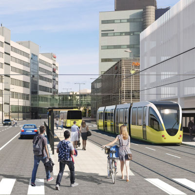 En framtidsvision över kollektivtrafiken vid Åbo teknologicentrum med gula snabbspårvagnar, fotgängare och bilar.