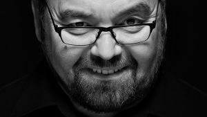 Reijo Perälä hymyilee kuvassa.
