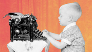 Pieni poika kirjoittaa kirjoituskoneella.