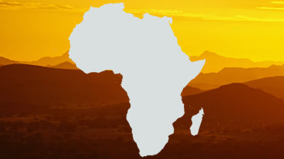Kuvassa on Afrikan manner ja taustalla vaaleanruskea maisemakuva.