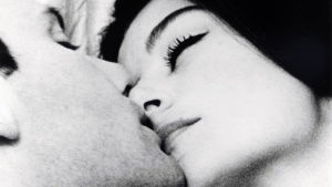 Mies ja nainen, Trintignant ja Aimée. Jean-Louis Trintignant ja Anouk Aimée lähikuvassa. Kuva elokuvasta Mies ja nainen (1966).
