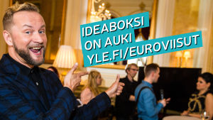 Mikko Silvennoinen kannustaa kuvassa antamaan ideoita Euroviisuille 2018