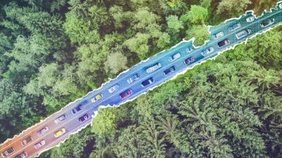 Kuvituskuva: yläkulmasta kuvattu autotie, joka kulkee metsän halki.