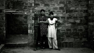 Två unga flickor väntade på kunder i Daulatdia i april 2008. Daulatdia är en by i centrala Bangladesh som helt domineras av prostitution och som beskrivs som en av de största bordellerna i världen. Två unga flickor väntade på kunder i Daulatdia i april 2008. Daulatdia är en by i centrala Bangladesh som helt domineras av prostitution och som beskrivs som en av de största bordellerna i världen.