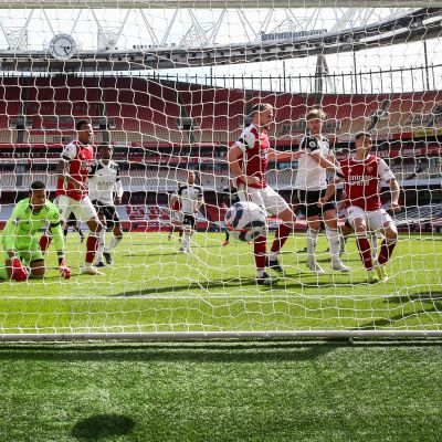 Eddie Nketiah (R) of Arsenal scores the 1-1 equalizer during the English Premier League soccer match between Arsenal FC and Fulham FC in London, Britain, 18 April 2021