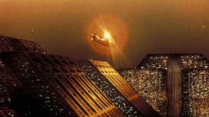 Människorna bor i futuristiska tempelliknande byggnader. En flygande bil över den futuristiska staden Los Angeles i Blade Runner.