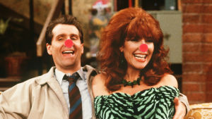 Var inte lika snål som Al Bundy med att donera på näsdagen! Al och Peggy Bundy med röda näsor. Grafik: Lasse Grönroos.