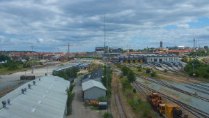 Anmälningarna om råttor har ökat markant bland annat i Århus. Vy över Århus med järnvägsdepå i förgrunden