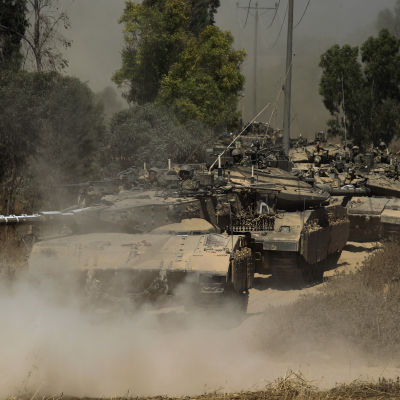 A column of Israeli Merkava tanks moving in southern Israel towards the border with the Gaza Strip, 01 August 2014.