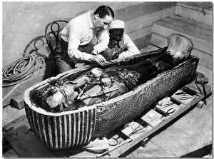 Howard Carter opens the innermost shrine of King Tutankhamen's tomb near Luxor, Egypt which one of carter's water boy found the steps down to.