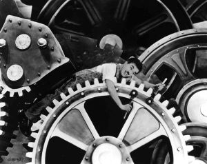 Charlie Chaplin i kugghjulet i filmen Moderna tider.
