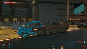 Kaksi autoa puolittain toistensa sisällä videopelissä.