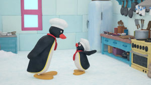 Pingu kaupungissa. kaksi animaatiopingviiniä keskustelee toistensa kanssa.