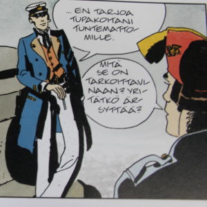 Corto osoittaa epäkunnioituksensa venetsialaisupseerille, joka löi tupakkaa tarjoavaa miestä. Kertomus Venetsiasta, 1977. Corto Maltese Venetsiassa.