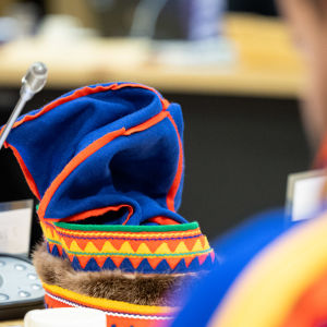 Sámi man's headdress on a table.
