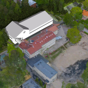 Bild där en ny tilläggsbyggnad ritats in bredvid skolhus