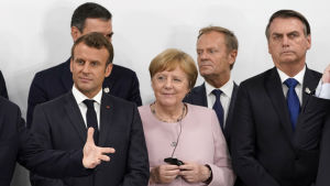 Emmanuel Macron, Angela Merkel, Donald Tusk, Jair Bolsonaro på G20-möte i Osaka i juni 2019 då klimatfrågor också fanns på agendan. G20-mötet i Osaka 29.6.2019. Emmanuel Macron, Angela Merkel, Donald Tusk, Jair Bolsonaro